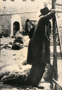 A man reflecting on the aftermath of the massacre in Hebron