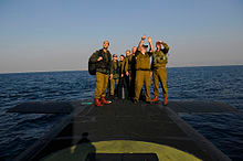  Israeli soldiers standing on a Dolphin-class submarine (CC IDF) 
